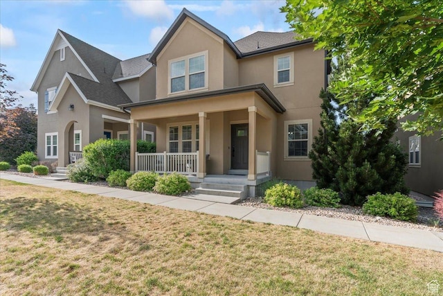 826 W 2630 N, Lehi, UT 84043 - view of front facade featuring stucco siding, covered porch, and a front yard