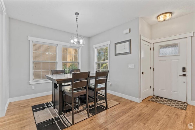 826 W 2630 N, Lehi, UT 84043 - dining area with light wood-type flooring, a chandelier, and baseboards