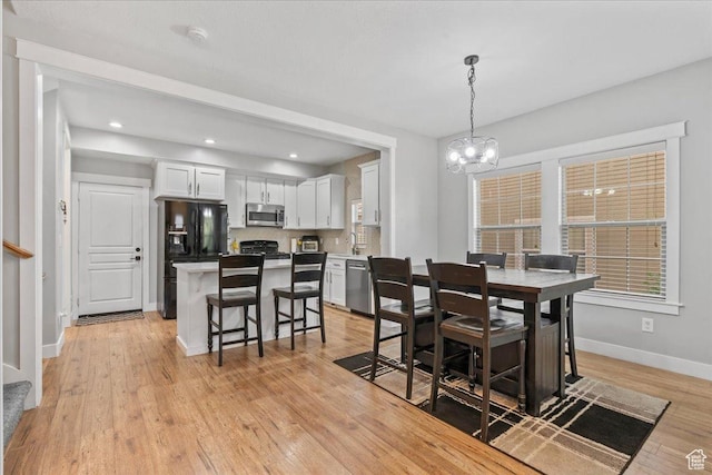 826 W 2630 N, Lehi, UT 84043 - dining space with a chandelier, baseboards, light wood-style flooring, and recessed lighting