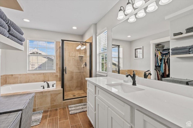 826 W 2630 N, Lehi, UT 84043 - full bath featuring a bath, a shower stall, vanity, a spacious closet, and recessed lighting