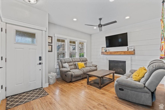 826 W 2630 N, Lehi, UT 84043 - living area featuring light wood-style flooring, ceiling fan, recessed lighting, and a glass covered fireplace