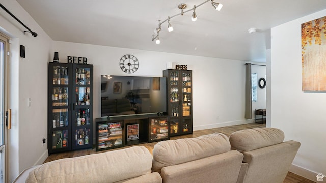 4475 S Lochnivar Ct E, Millcreek, UT 84107 - living room featuring baseboards, wood finished floors, and rail lighting