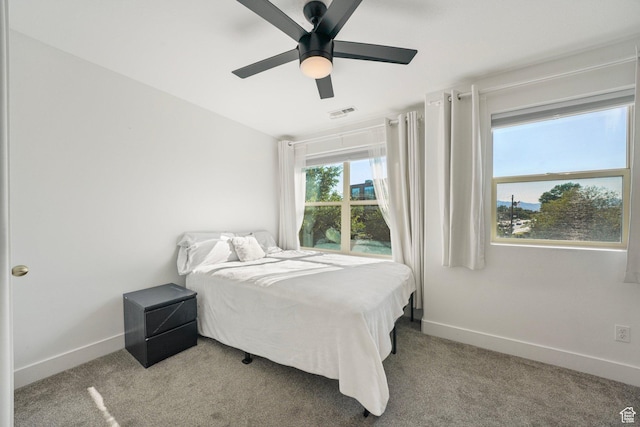 4475 S Lochnivar Ct E, Millcreek, UT 84107 - carpeted bedroom with baseboards and a ceiling fan