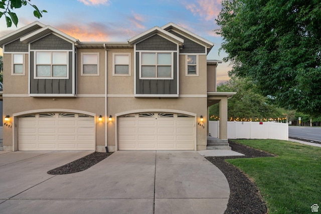 4475 S Lochnivar Ct E, Millcreek, UT 84107 - view of front of home featuring concrete driveway, a garage, and stucco siding
