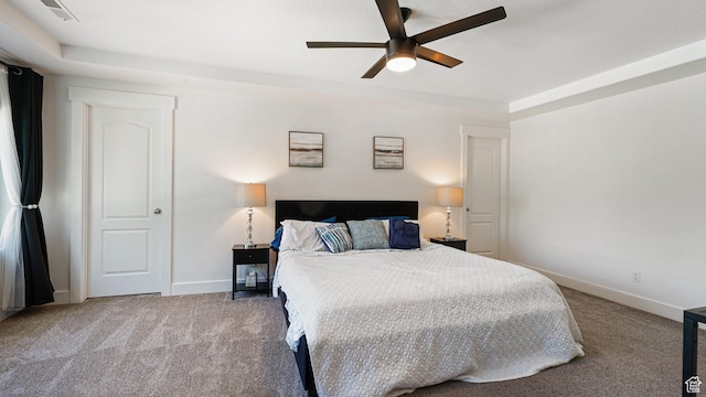 4475 S Lochnivar Ct E, Millcreek, UT 84107 - carpeted bedroom with baseboards, a raised ceiling, and ceiling fan