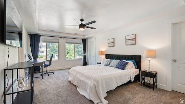 4475 S Lochnivar Ct E, Millcreek, UT 84107 - bedroom featuring carpet, a raised ceiling, baseboards, a ceiling fan, and a textured ceiling