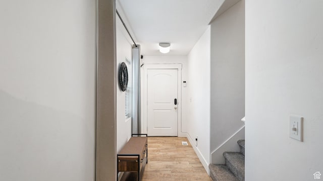 4475 S Lochnivar Ct E, Millcreek, UT 84107 - corridor featuring light wood-style flooring, stairs, and baseboards