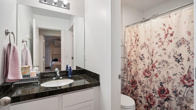 4475 S Lochnivar Ct E, Millcreek, UT 84107 - ensuite bathroom with vanity, a shower with curtain, and toilet