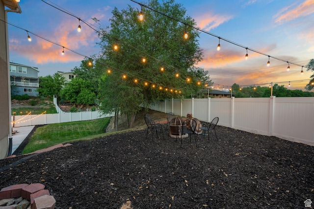 4475 S Lochnivar Ct E, Millcreek, UT 84107 - yard at dusk with an outdoor fire pit