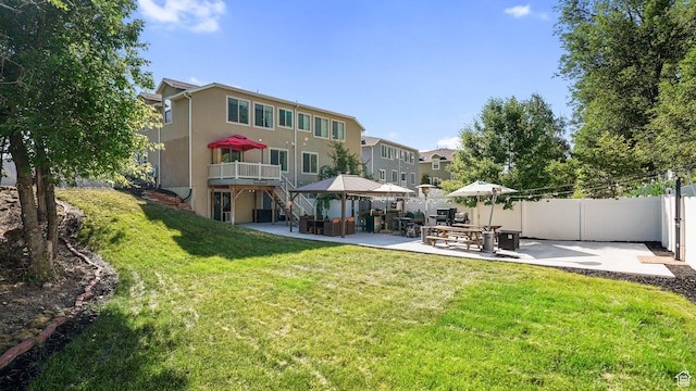 4475 S Lochnivar Ct E, Millcreek, UT 84107 - back of property with a patio, stucco siding, a gazebo, and a deck