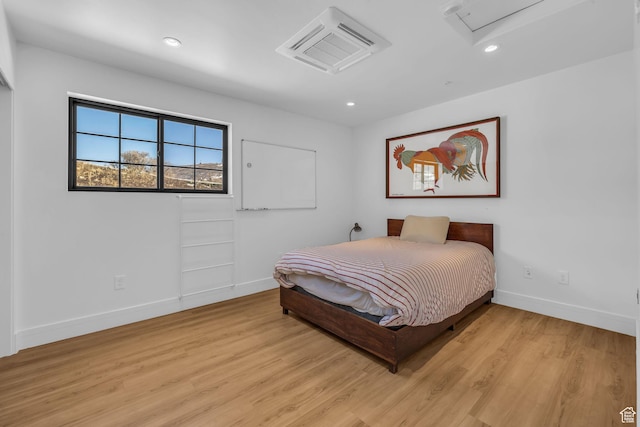 1200 W Lori Ln Unit B7, Kamas, UT 84036 - bedroom with light wood-style flooring, baseboards, and recessed lighting