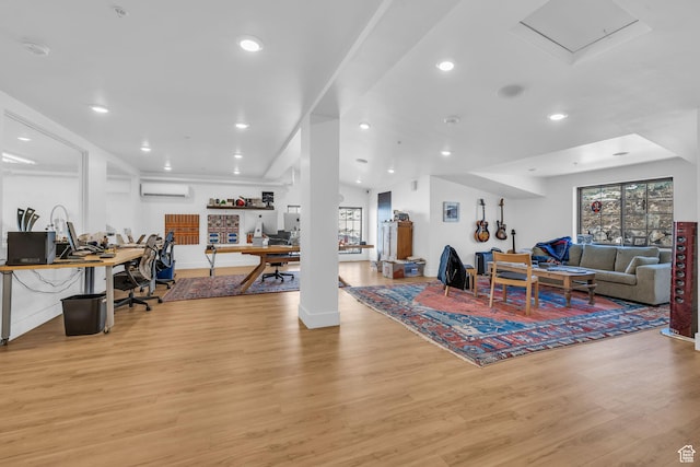 1200 W Lori Ln Unit B7, Kamas, UT 84036 - living area with light wood-style floors, a wall mounted air conditioner, recessed lighting, and baseboards