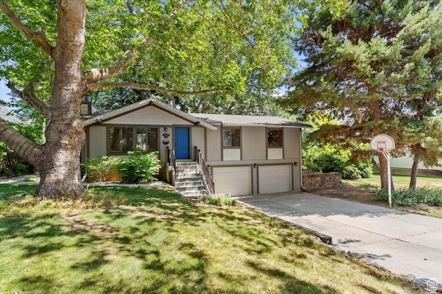 2640 N 850 E, North Ogden, UT 84414 - view of front of house featuring an attached garage, driveway, and a front lawn