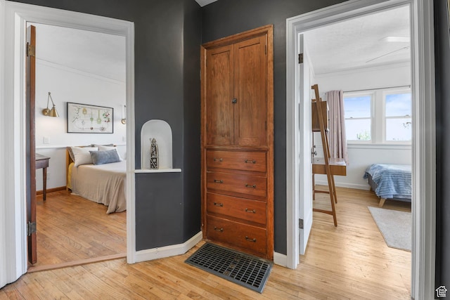 525 E St, Salt Lake City, UT 84103 - bedroom featuring crown molding, light wood-style flooring, and baseboards