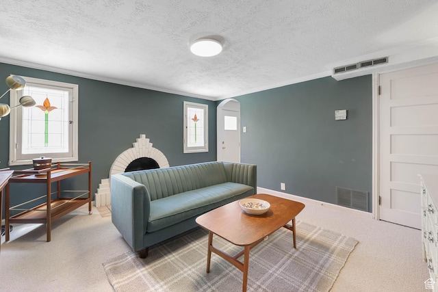 525 E St, Salt Lake City, UT 84103 - living area featuring a textured ceiling, arched walkways, crown molding, carpet flooring, and baseboards