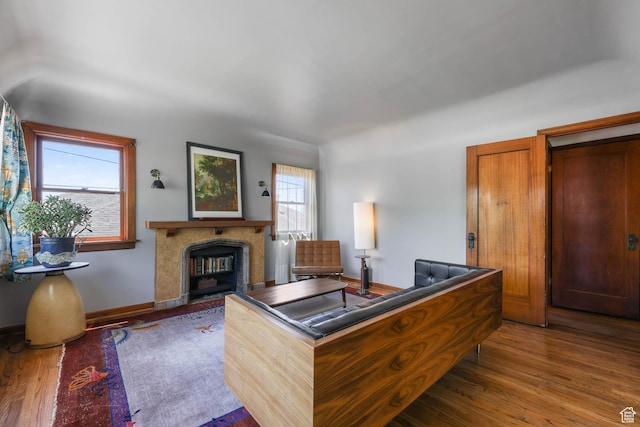 525 E St, Salt Lake City, UT 84103 - living room featuring wood finished floors, a fireplace, and baseboards