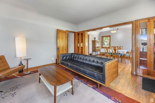 525 E St, Salt Lake City, UT 84103 - living room featuring wood-type flooring and baseboards