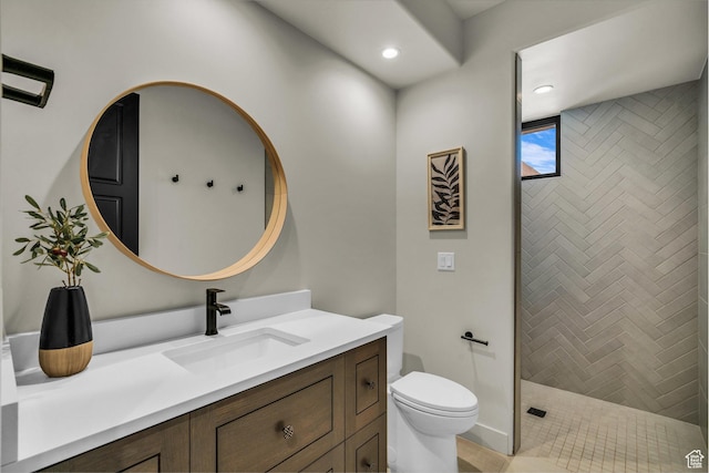 2304 N Cohonina Trl, St George, UT 84770 - bathroom featuring vanity, toilet, tiled shower, and recessed lighting
