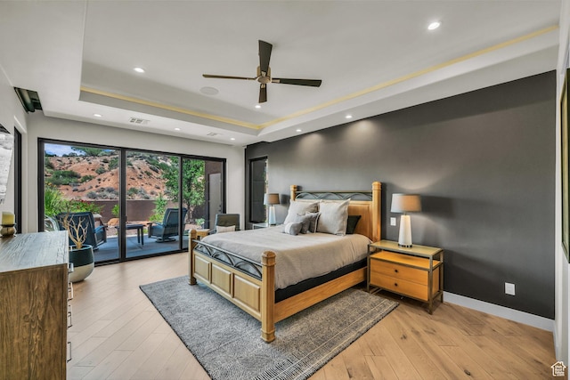 2304 N Cohonina Trl, St George, UT 84770 - bedroom with a tray ceiling, access to outside, light wood-style flooring, baseboards, and recessed lighting