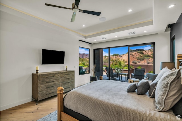 2304 N Cohonina Trl, St George, UT 84770 - bedroom with access to outside, light wood-style flooring, baseboards, recessed lighting, and a tray ceiling