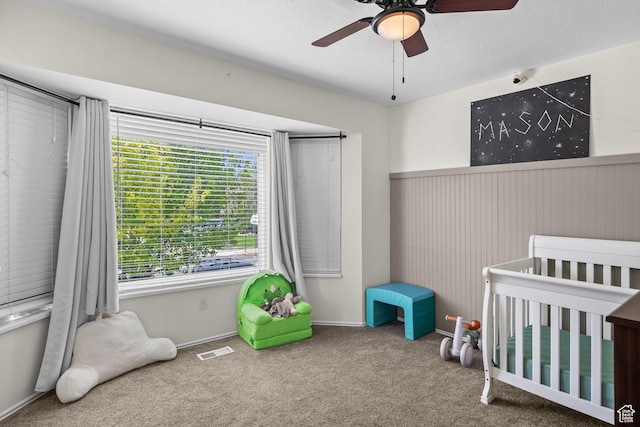 6097 S Azure Meadow Dr, Taylorsville, UT 84129 - bedroom with a crib, carpet, and ceiling fan