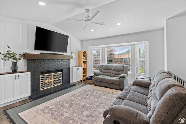 6097 S Azure Meadow Dr, Taylorsville, UT 84129 - living room with ceiling fan, dark wood finished floors, a fireplace, lofted ceiling, and recessed lighting
