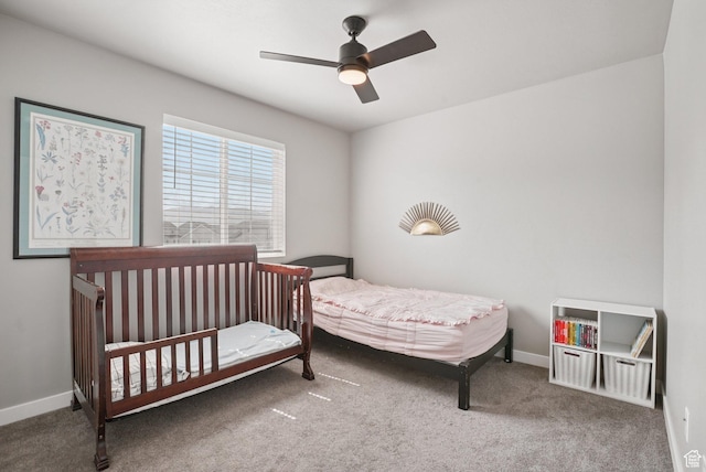 1123 W Osprey Dr, Stansbury Park, UT 84074 - carpeted bedroom with baseboards and a ceiling fan