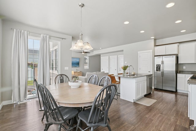 1123 W Osprey Dr, Stansbury Park, UT 84074 - dining space with dark wood-style flooring and recessed lighting