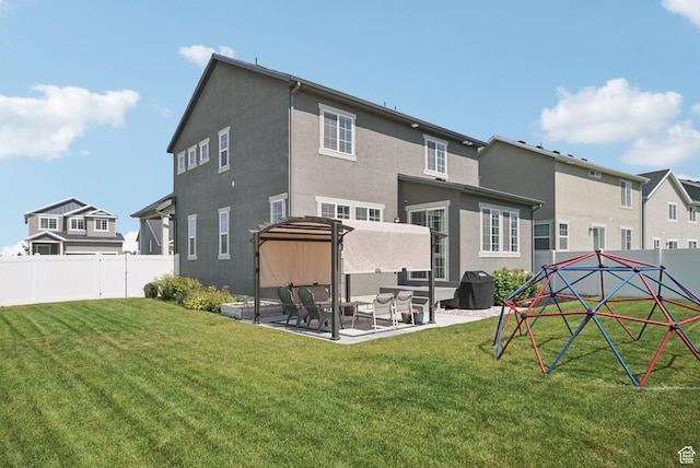 1123 W Osprey Dr, Stansbury Park, UT 84074 - rear view of house with a patio, stucco siding, and a residential view
