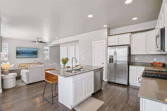 1123 W Osprey Dr, Stansbury Park, UT 84074 - kitchen featuring stainless steel appliances, a sink, dark wood-type flooring, a ceiling fan, and recessed lighting