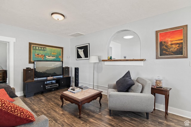 195 S 200 E, Monroe, UT 84754 - living area with dark wood-style floors, baseboards, and arched walkways