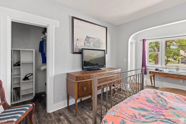 195 S 200 E, Monroe, UT 84754 - bedroom with a walk in closet, wood finished floors, baseboards, and a closet
