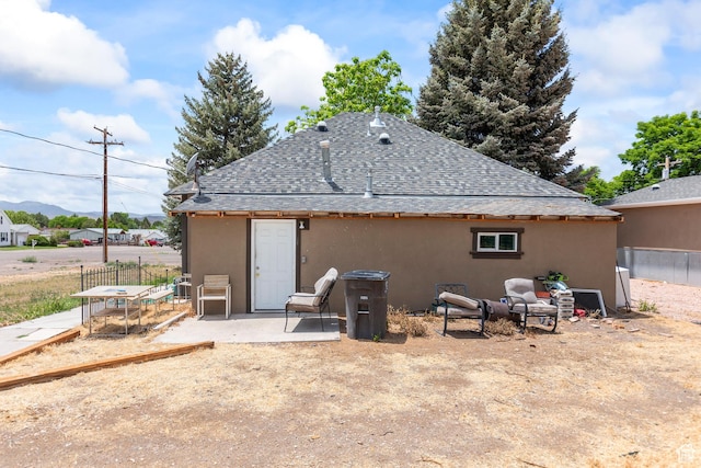 195 S 200 E, Monroe, UT 84754 - back of house with a shingled roof, stucco siding, and a patio area