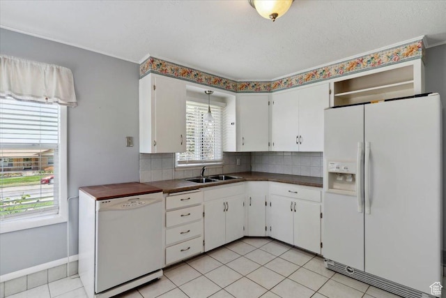 630 Polk Ave, Ogden, UT 84404 - kitchen with white appliances, a sink, dark countertops, and backsplash