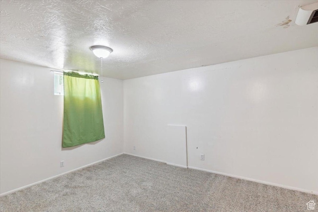 630 Polk Ave, Ogden, UT 84404 - spare room with carpet floors, a textured ceiling, and baseboards