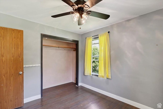 630 Polk Ave, Ogden, UT 84404 - unfurnished bedroom with baseboards, a closet, dark wood-style flooring, and a ceiling fan