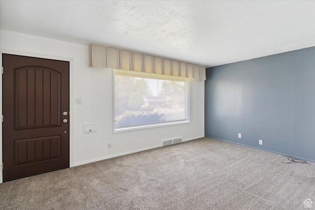 630 Polk Ave, Ogden, UT 84404 - carpeted entrance foyer featuring baseboards