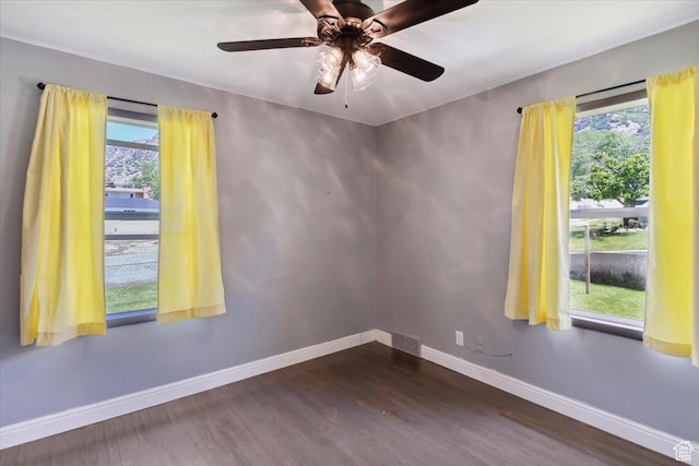 630 Polk Ave, Ogden, UT 84404 - spare room with dark wood-style flooring, baseboards, plenty of natural light, and a ceiling fan