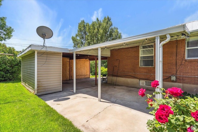 630 Polk Ave, Ogden, UT 84404 - view of patio with an attached carport and driveway