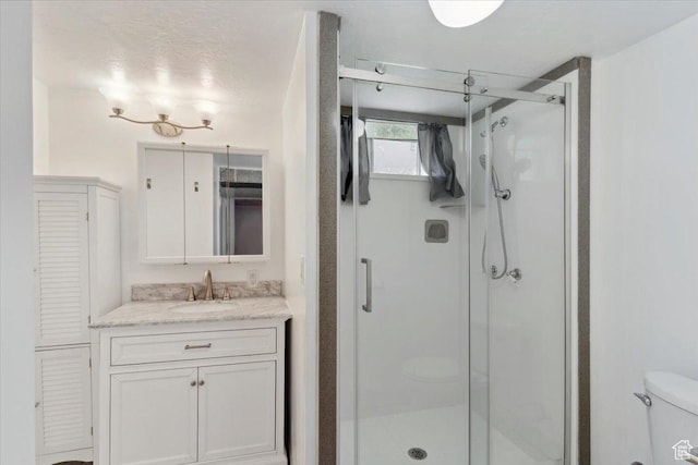 630 Polk Ave, Ogden, UT 84404 - full bathroom with a stall shower, toilet, vanity, and a closet