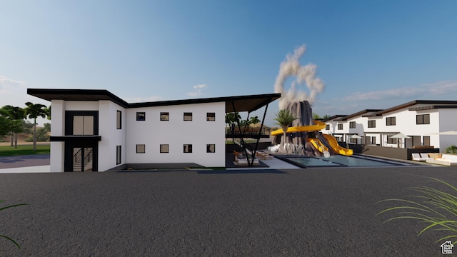 306 E 500 N Unit 34, Hurricane, UT 84737 - view of front of home with a playground and stucco siding
