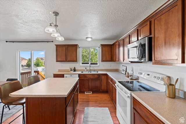 6286 W Anders Ridge Way S, West Valley City, UT 84128 - kitchen featuring stainless steel microwave, white electric range, a sink, a textured ceiling, and light countertops
