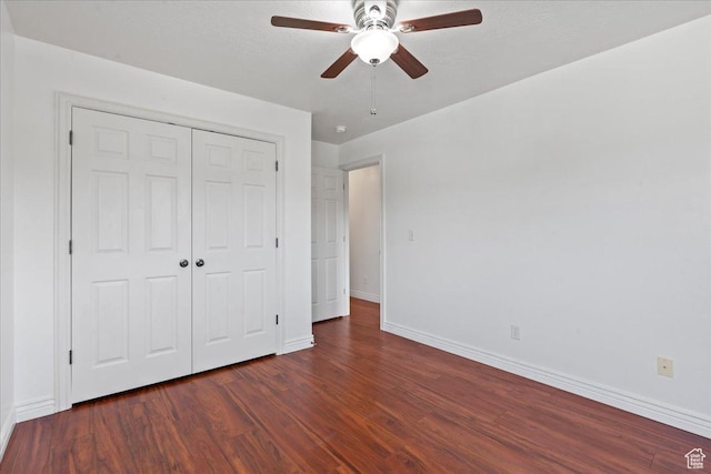 6286 W Anders Ridge Way S, West Valley City, UT 84128 - unfurnished bedroom featuring wood finished floors, baseboards, a closet, and a ceiling fan