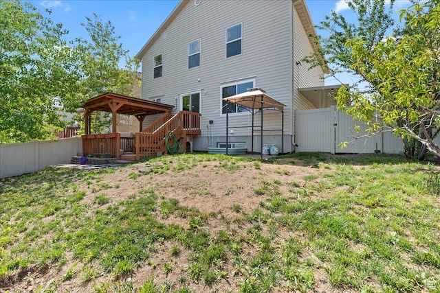 6286 W Anders Ridge Way S, West Valley City, UT 84128 - rear view of house with a gazebo, a fenced backyard, and a gate