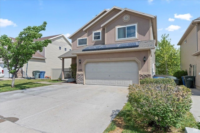 6286 W Anders Ridge Way S, West Valley City, UT 84128 - traditional home with stucco siding, driveway, stone siding, and a garage