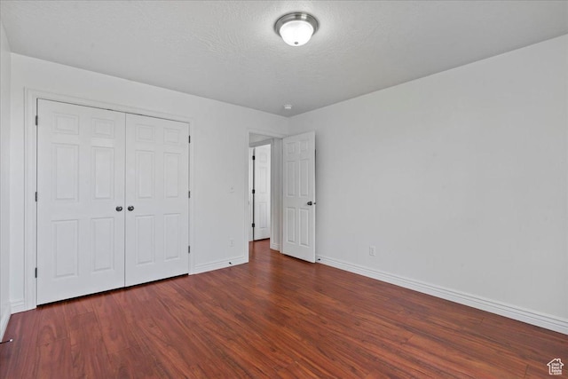 6286 W Anders Ridge Way S, West Valley City, UT 84128 - unfurnished bedroom featuring baseboards, wood finished floors, and a closet
