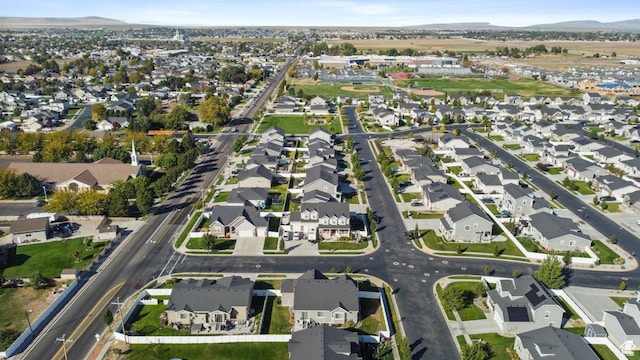 665 S 1400 W, Syracuse, UT 84075 - aerial overview of property's location with nearby suburban area and a mountainous background