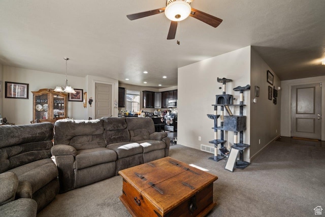 665 S 1400 W, Syracuse, UT 84075 - living room featuring carpet floors, a ceiling fan, baseboards, recessed lighting, and a chandelier