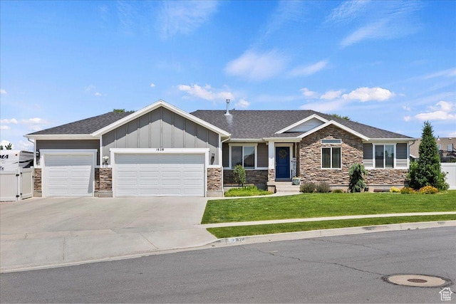 1628 W 1050 S, Syracuse, UT 84075 - craftsman house with stone siding, a garage, a front lawn, board and batten siding, and concrete driveway