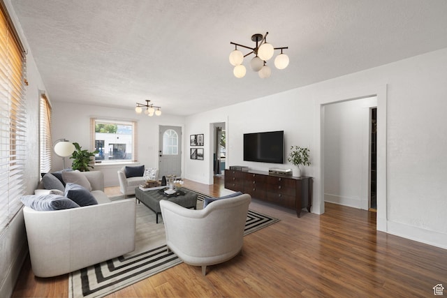234 W 500 S, Provo, UT 84601 - living room with a chandelier, wood finished floors, a textured ceiling, and baseboards